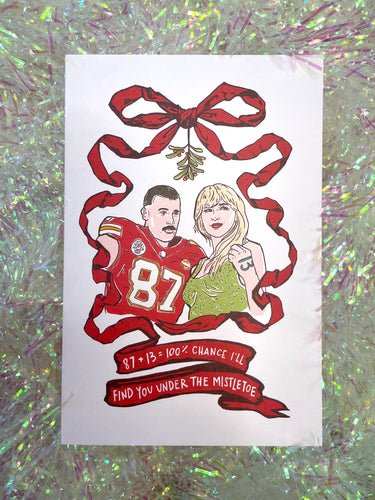 Taylor and Travis Under the Mistletoe